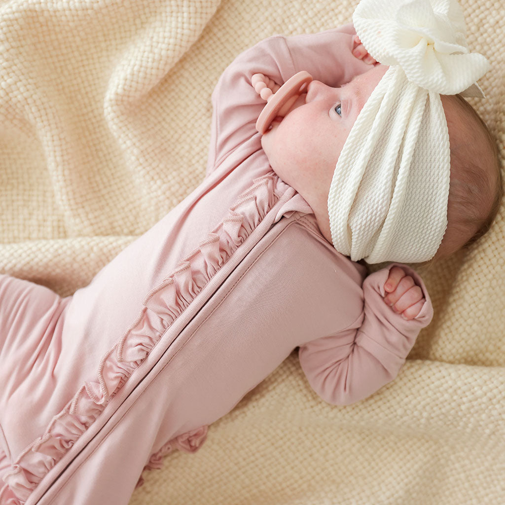 Delaney Blush Footie Ruffled Zippered One Piece