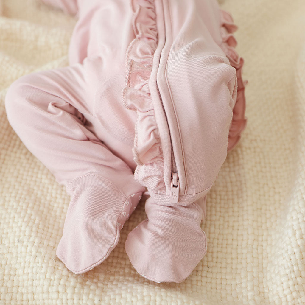 Delaney Blush Footie Ruffled Zippered One Piece